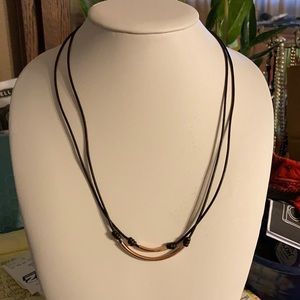 Double strand brass tubes on leather cords